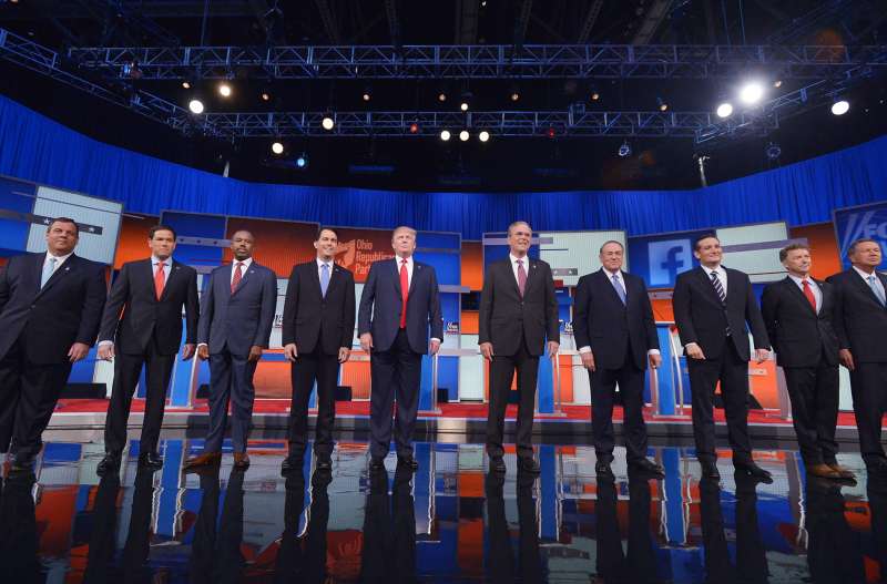 Republican 2016 presidential candidates, left to right, New Jersey Governor Chris Christie, U.S. Senator Marco Rubio, Dr. Ben Carson, Wisconsin Governor Scott Walker, businessman Donald Trump, former Florida Governor Jeb Bush, former Arkansas Governor Mike Huckabee, U.S. Senator Ted Cruz, U.S. Senator Rand Paul and Ohio Governor John Kasich pose at the start of the first official Republican presidential candidates debate in Cleveland on August 6, 2015.