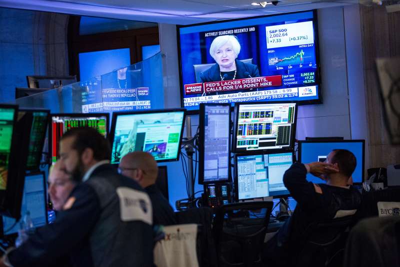 A trader works on the floor of the New York Stock Exchange while Federal Reserve Chairwoman Janet Yellen explains why the Federal Reserve chose not raise interest rates on September 17, 2015 in New York, United States. Traders had speculated for weeks over whether the fed would raise rates or keep them at near zero percent interest.