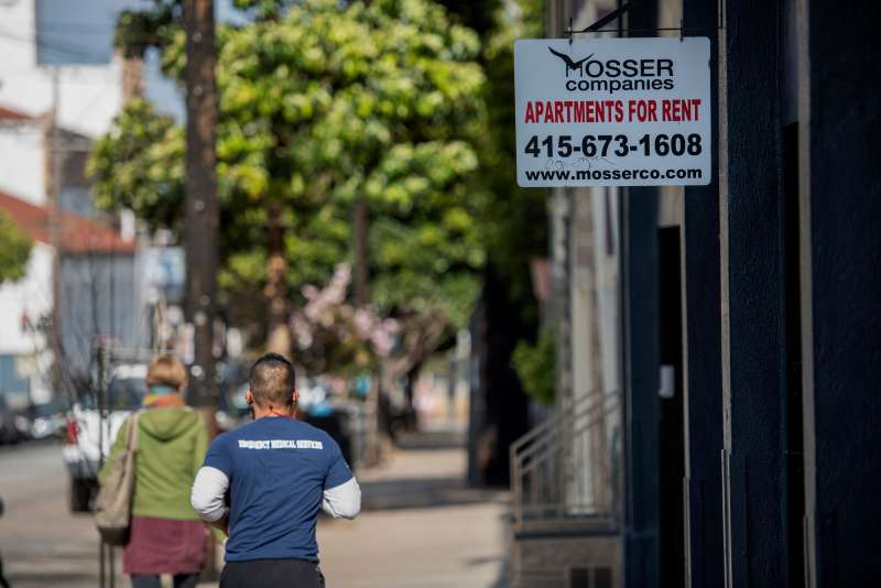 Pedestrians walk past a For Rent sign that is displayed outside of an apartment building in the Mission district of San Francisco, California, U.S., on Thursday, May 7, 2015. San Francisco Mayor Ed Lee will seek voter approval for the first housing bond since 1996 as his city becomes the least affordable U.S. housing market and uproar grows about gentrification fueled by the technology boom.