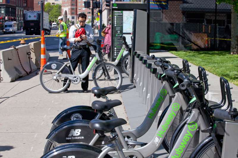 A cyclist rents a bike from Hubway outside North Station, on May 17, 2013 in Boston, Massachusetts. Hubway is a bike-sharing system with more than 100 stations and 1000 bikes available in Boston, Brookline, Cambridge and Somerville. Riders can buy annual, monthly, 3-day or 24 hour memberships. Members get a key to use three seasons of the year.