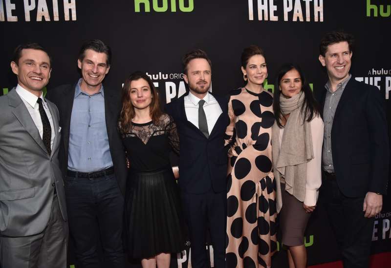 Actor Hugh Dancy, Chief Executive Officer, Hulu, Mike Hopkins, Head of Original Programming at Hulu, Beatrice Springborn, actors Aaron Paul, Michelle Monaghan, President, Universal Television, Bela Bajaria and Senior Vice President, Head of Content, Hulu, Craig Erwich attend the premiere of Hulu's 'The Path' at ArcLight Hollywood on March 21, 2016 in Hollywood, California.