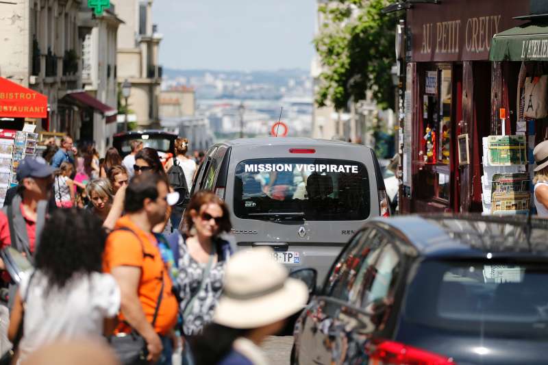 A car, part of Operation Vigipirate , patrols in the Montmartre neighbourhood of Paris on July 15, 2016, a day after the attack in Nice. A Tunisian-born man zigzagged a truck through a crowd celebrating Bastille Day in the French city of Nice, killing at least 84 and injuring dozens of children in what President Francois Hollande on July 15 called a terrorist attack.
