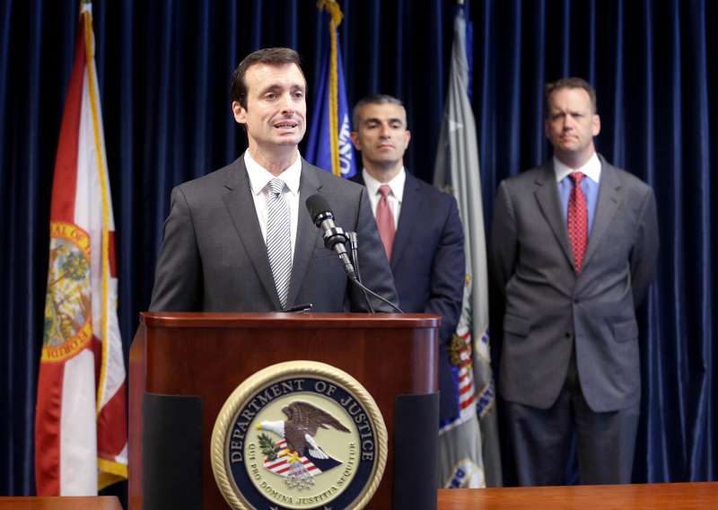 Wifredo Ferrer, left, U.S. Attorney for the Southern District of Florida, speaks during a news conference along with George Piro, center, Special Agent in Charge for the Federal Bureau of Investigation Miami and Tyler Smith, Assistant Inspector General of the U.S. Department of Health and Human Services, Office of Inspector General, Tuesday, May 13, 2014 in Miami.