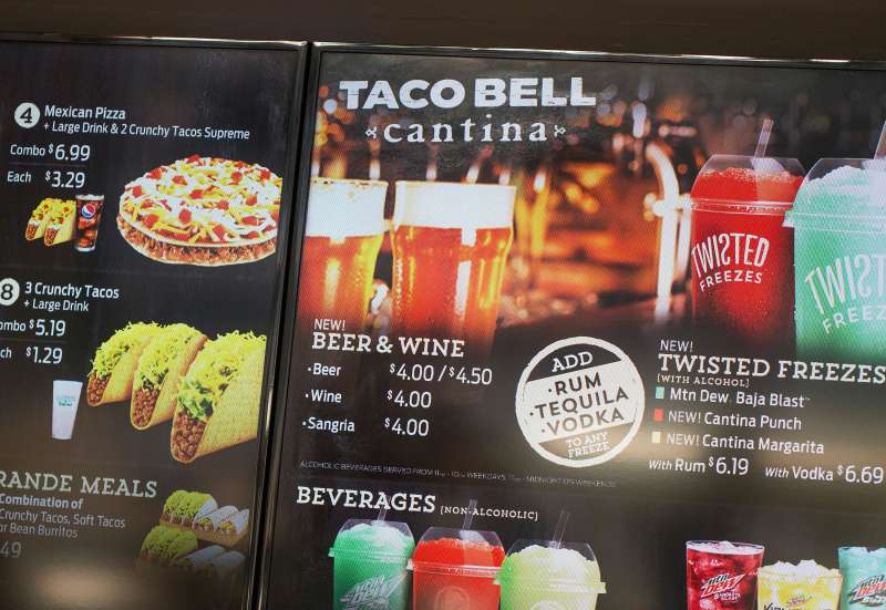 The menu at a Taco Bell Cantina restaurant lists alcoholic beverages for sale on September 22, 2015 in Chicago, Illinois. The restaurant is Taco Bell's first to serve alcohol. Along with the regular fast food menu guest can also order beer, wine, sangria and twisted Freezes which can be mixed with rum, tequila or vodka.