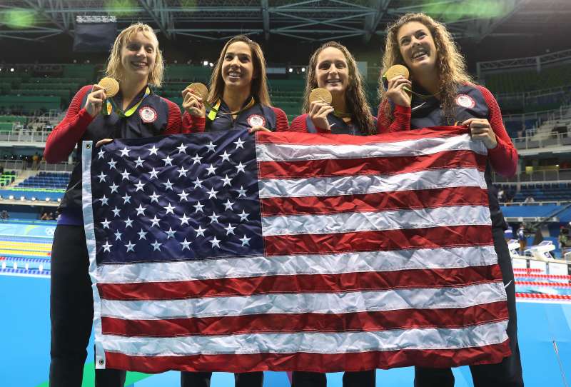 Katie Ledecky, Maya Dirado, Leah Smith and Allison Schimdt of the United States pose with their gold medals from the Women's 4 x 20m Freestyle Relay at the Rio 2016 Olympic Games at the Olympic Aquatics Stadium on August 10, 2016 in Rio de Janeiro, Brazil. (Photo by Ian MacNicol/Getty Images)