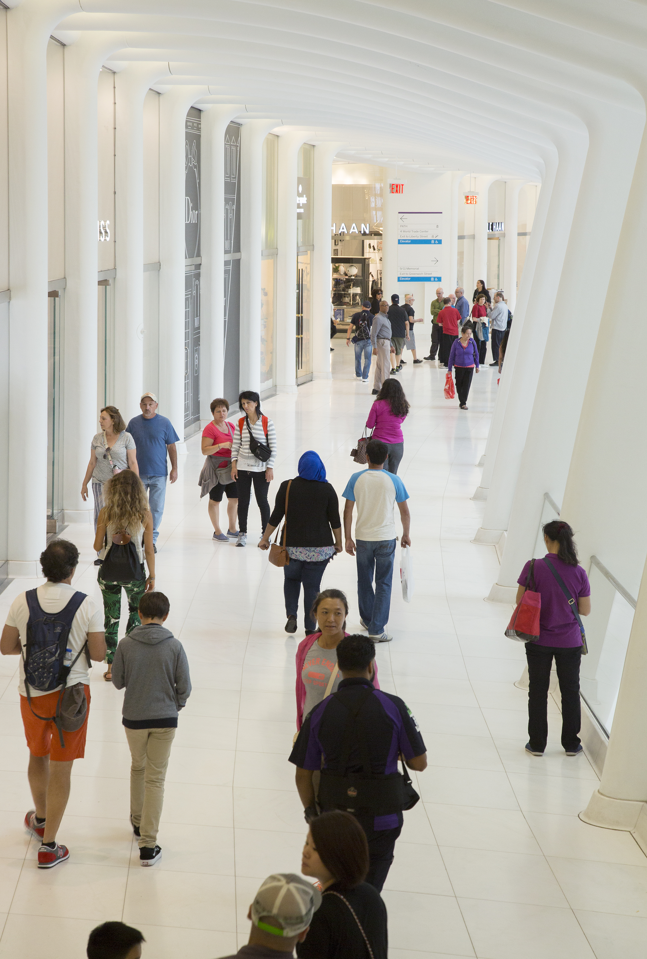 Shoppers walk through Westfield World Trade Center, which houses stores ranging from Banana Republic to Christian Dior, Kate Spade and John Varvatos.