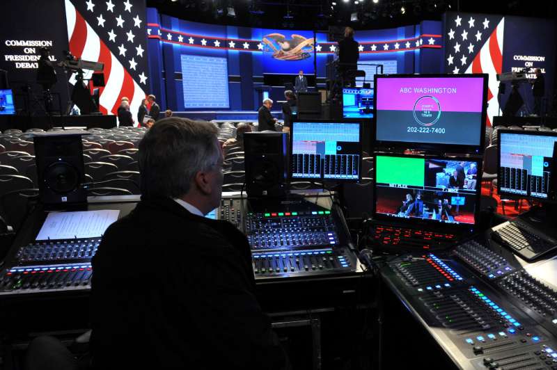 A TV technician is seen by the stage of the first presidential debate at Hofstra University's David & Mack Sport and Exhibition Complex in Hempstead, New York on September 26, 2016. The first US presidential debate, between Democratic candidate Hillary Clinton and Republican Donald Trump, is one of the high points of the campaign, six weeks from the November 8 elections.
