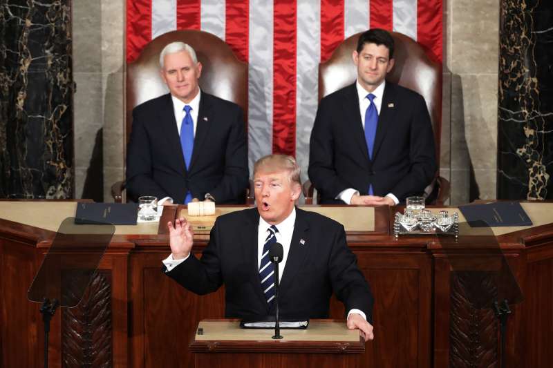U.S. President Donald Trump addresses a joint session of the U.S. Congress as Vice President Mike Pence (L) and House Speaker Rep. Paul Ryan (R) (R-WI) look on on February 28, 2017 in the House chamber of the U.S. Capitol in Washington, DC. Trump's first address to Congress focused on national security, tax and regulatory reform, the economy, and healthcare.