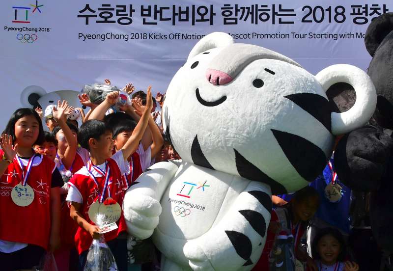 South Korean students react to one of the mascots for the 2018 Pyeongchang Winter Olympics, a white tiger named Soohorang , during the mascots' first public staging event at Hoenggye elementary school in Pyeongchang, about 150 kms east of Seoul, on July 18, 2016.
The PyeongChang 2018 Organizing Committee announced a nationwide mascot promotion tour, plus a tour to the Rio Games for more active international promotion as well as a reach to major cities and festivals in South Korea. / AFP / JUNG YEON-JE (Photo credit should read JUNG YEON-JE/AFP/Getty Images)