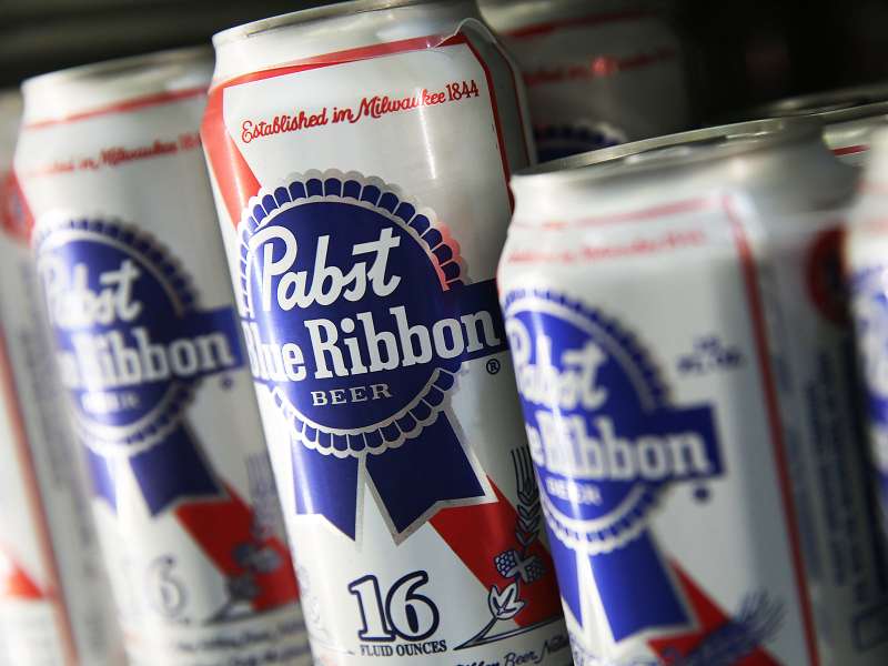 SAN FRANCISCO, CA - SEPTEMBER 22: Cans of Pabst Blue Ribbon beer sit on a shelf at a convenience store on September 22, 2014 in San Francisco, California. Pabst Brewing Co., the maker of Pabst Blue Ribbon announced that they are selling their company to Russian company Oasis Beverages for an undisclosed sales price. (Photo by Justin Sullivan/Getty Images)