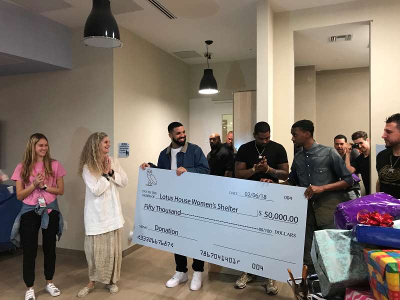 This is the moment music superstar Drake surprises a womens shelter in Miami with a $50,000 donation. The Grammy award winner dropped off the huge cheque at the Lotus Village on Tuesday February 6. He also handed toys to the kids and $150 Target gift cards to all 130 women residing in the facility. The non profit organization, which is the only homeless shelter for women and children in Miami, is seeking to raise $25 million to help expand their outreach.