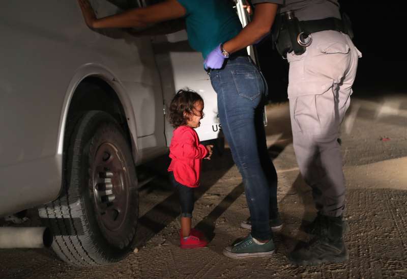A two-year-old Honduran asylum seeker cries as her mother is searched and detained near the U.S.-Mexico border on June 12, 2018 in McAllen, Texas. The asylum seekers had rafted across the Rio Grande from Mexico and were detained by U.S. Border Patrol agents before being sent to a processing center for possible separation. Customs and Border Protection (CBP) is executing the Trump administration's zero tolerance policy towards undocumented immigrants. U.S. Attorney General Jeff Sessions also said that domestic and gang violence in immigrants' country of origin would no longer qualify them for political asylum status.