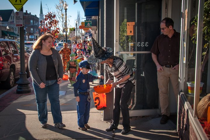 child trick or treating at a local business in Brighton, Boston, Massachusetts