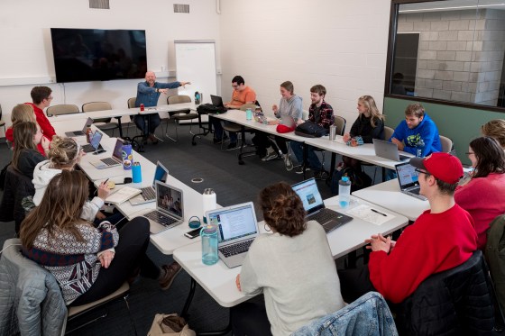 Teacher and students in a classroom at Saint John's University