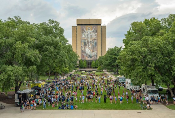 Students gather on the Library Quad at University of Notre Dame, where Food Trucks served food following Opening Mass