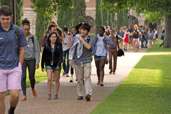 Students walk around campus of Rice University in Texas