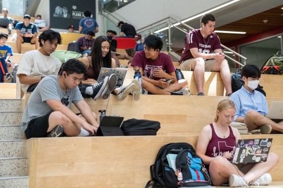 Students working on their computers at the Texas A&M University campus