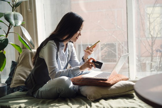 Woman using her laptop to look at her bank account