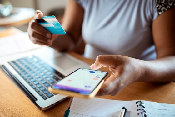 Close-up of a woman using a smartphone to look at her online bank account